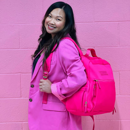 Woman wearing the Sarah Wells Fiona pump backpack in hot pink