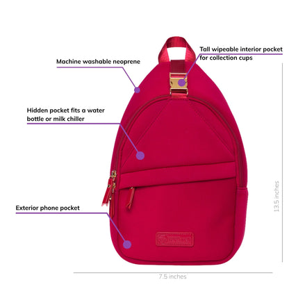 Sarah Wells Allie pump sling in Ruby, front view, labeled with a hidden pocket for a water bottle or milk chiller, an exterior phone pocket, a tall wipeable interior pocket for collection cups, and machine washable neoprene; 13.5"H x 7.5"W x 3"D
