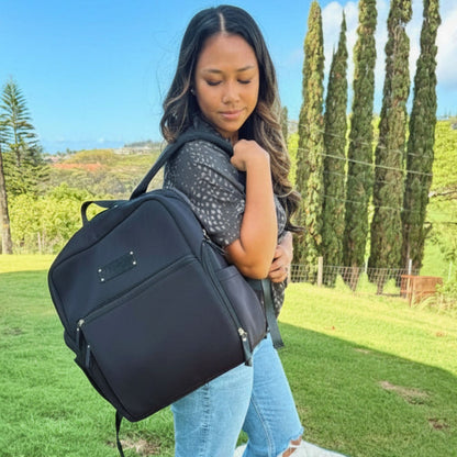 Woman wearing the Sarah Wells Fiona pump backpack in Black to work or as a diaper bag