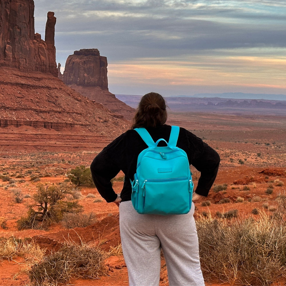 Woman wearing the Sarah Wells Fiona pump backpack in Sky