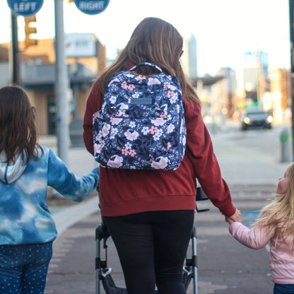 Woman wearing the Sarah Wells Kelly pump bag in fulfilment as a backpack or carrying it as a tote