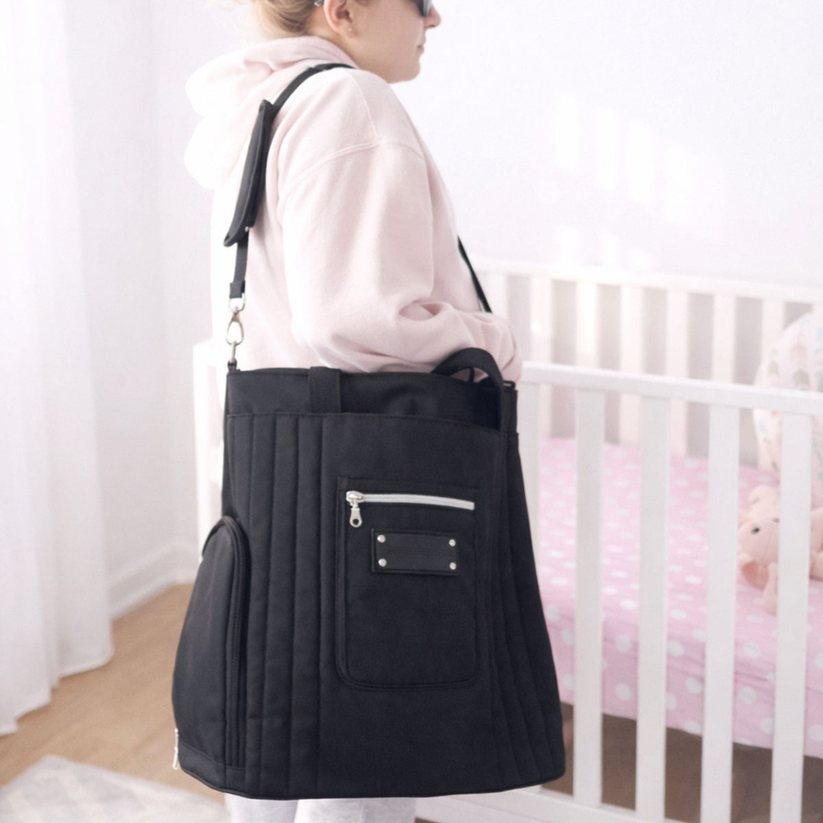 Woman carrying the Sarah Wells Suzy pump tote in Black in a real-world setting