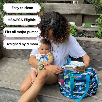 Woman carrying the Sarah Wells Kelly pump bag in aquarelle, with badges for easy to clean, HSA/FSA eligible, fits all major pumps, and designed by a mom