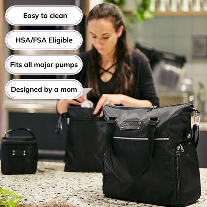 Woman carrying the Sarah Wells Lizzy pump tote in Black, with badges for easy to clean, HSA/FSA eligible, fits all major pumps, and designed by a mom