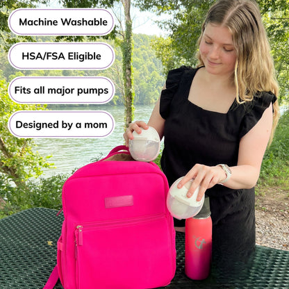 Woman carrying the Sarah Wells Fiona pump backpack in hot pink, with badges for machine washable, HSA/FSA eligible, fits all major pumps, and designed by a mom
