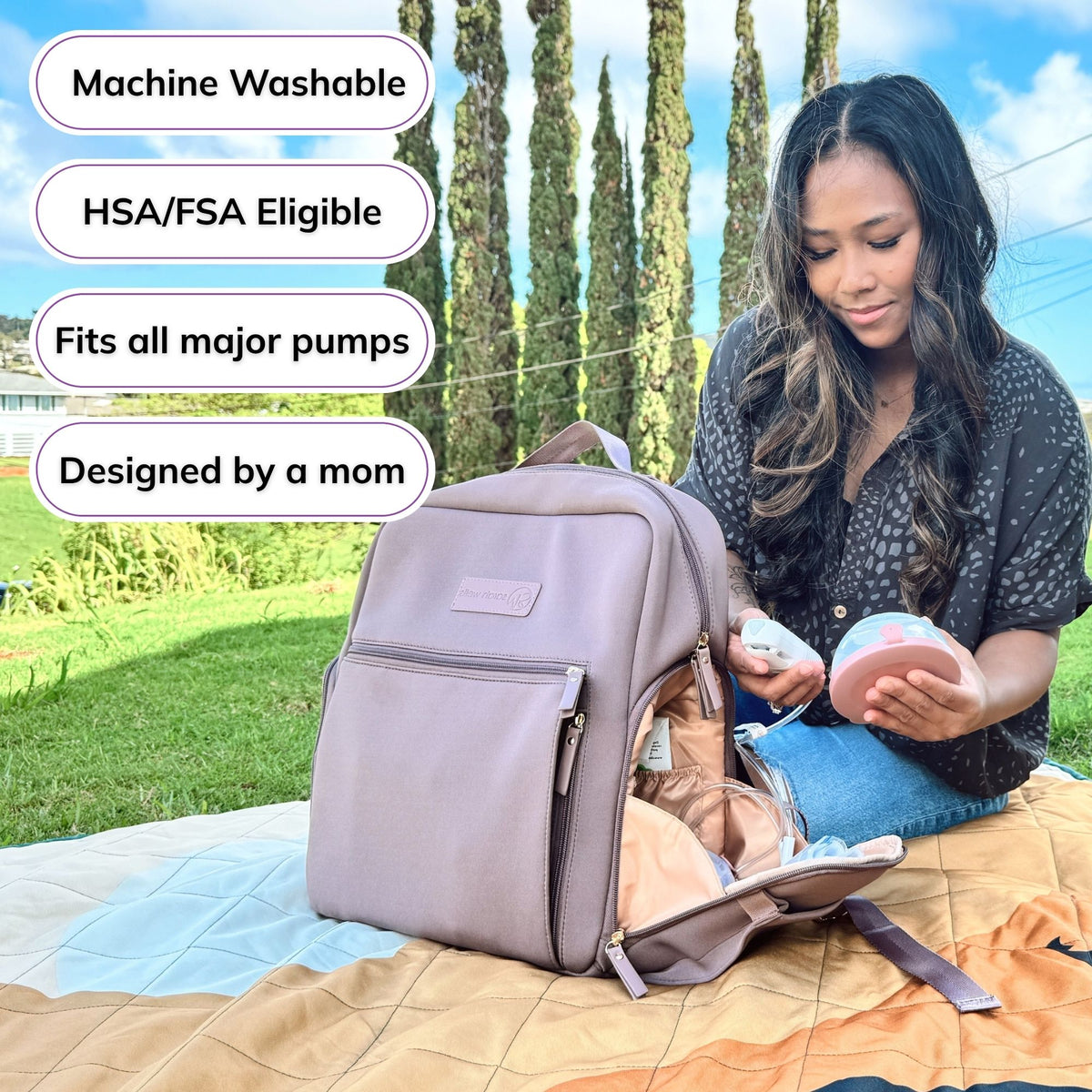 Woman carrying the Sarah Wells Fiona pump backpack in Earth, with badges for machine washable, HSA/FSA eligible, fits all major pumps, and designed by a mom