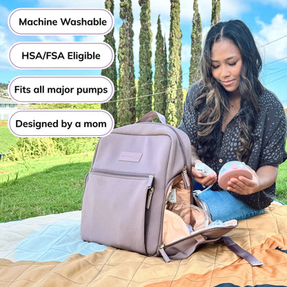 Woman carrying the Sarah Wells Fiona pump backpack in Earth, with badges for machine washable, HSA/FSA eligible, fits all major pumps, and designed by a mom