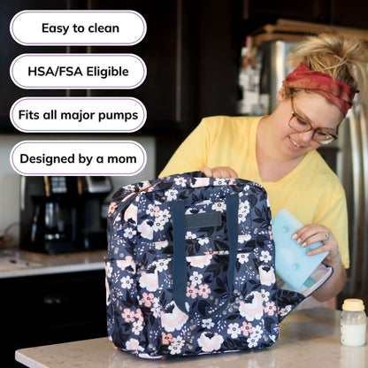 Woman carrying the Sarah Wells Kelly pump bag in le floral, with badges for easy to clean, HSA/FSA eligible, fits all major pumps, and designed by a mom